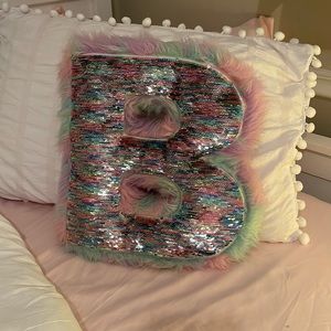 Reversible sequenced and fuzzy initial “B” pillow